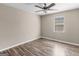 Bedroom with a ceiling fan and wood-look flooring at 195 Brighton Dr, Covington, GA 30016