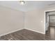 Bedroom with wood-look flooring and a door at 195 Brighton Dr, Covington, GA 30016