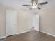 Bedroom featuring neutral walls, hardwood floors, and a ceiling fan at 195 Brighton Dr, Covington, GA 30016