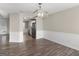 Dining room featuring hardwood floors and views into the kitchen at 195 Brighton Dr, Covington, GA 30016