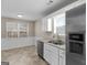 Well-lit kitchen with stainless steel appliances and granite countertops at 195 Brighton Dr, Covington, GA 30016