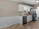 Open kitchen featuring stainless steel dishwasher and granite countertops at 195 Brighton Dr, Covington, GA 30016