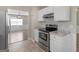 Modern kitchen with stainless steel oven and view into the living room at 195 Brighton Dr, Covington, GA 30016