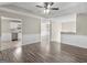 Open-concept living room featuring hardwood floors and views into the kitchen at 195 Brighton Dr, Covington, GA 30016