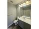 Bathroom featuring a gray vanity, framed mirror, and a shower-tub combo at 6206 Flat Trace, South Fulton, GA 30291