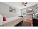 Neat bedroom with hardwood floors, neutral gray walls, and a TV for relaxing entertainment at 10175 Point View Dr, Jonesboro, GA 30238