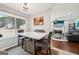 Cozy breakfast nook with marble table and view to a green backyard at 10175 Point View Dr, Jonesboro, GA 30238