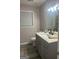 Updated bathroom featuring a modern vanity with a sleek faucet and new fixtures at 1700 Mccollum Rd, Sw, Conyers, GA 30094