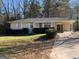 Charming single-story home with a cozy carport and well-maintained front yard at 1700 Mccollum Rd, Sw, Conyers, GA 30094