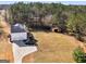 Aerial view of the home, expansive yard, storage shed, and long driveway at 231 Ashley Trace Dr, Locust Grove, GA 30248