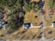Aerial view of the property featuring fenced yard, home, and surrounding woods at 231 Ashley Trace Dr, Locust Grove, GA 30248