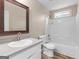 Bathroom features a mirror, vanity with sink, toilet, and a shower-tub combination at 231 Ashley Trace Dr, Locust Grove, GA 30248