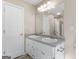 Bathroom featuring dual sinks, a large mirror, and updated fixtures at 231 Ashley Trace Dr, Locust Grove, GA 30248
