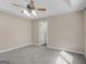 Bedroom featuring trey ceilings, a ceiling fan, carpet flooring, and neutral walls at 231 Ashley Trace Dr, Locust Grove, GA 30248