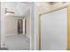 View into bedroom from bathroom with neutral walls, carpet, ceiling fan and doorway to ensuite bath with shower at 231 Ashley Trace Dr, Locust Grove, GA 30248