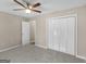 Bedroom showcasing neutral carpet, closet, and natural lighting at 231 Ashley Trace Dr, Locust Grove, GA 30248