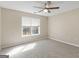Bedroom with neutral walls, carpet floors, a window with blinds, and a ceiling fan at 231 Ashley Trace Dr, Locust Grove, GA 30248