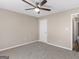 Bedroom with carpet flooring, a ceiling fan, and white walls at 231 Ashley Trace Dr, Locust Grove, GA 30248
