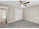 Spacious bedroom featuring ceiling fan, carpeted flooring, and closet at 231 Ashley Trace Dr, Locust Grove, GA 30248