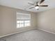Comfortable bedroom with carpeted floor and a window at 231 Ashley Trace Dr, Locust Grove, GA 30248