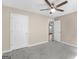 Bedroom featuring carpet flooring, a ceiling fan, and an open doorway at 231 Ashley Trace Dr, Locust Grove, GA 30248