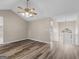 Loft area showcasing hardwood floors and views of a chandelier at 231 Ashley Trace Dr, Locust Grove, GA 30248