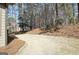 View of the backyard showing the lawn, a wooded perimeter, and part of the house at 245 Highview Trce, Fayetteville, GA 30215