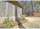Exterior backyard view with brick and mulch flower bed and the side of the house at 245 Highview Trce, Fayetteville, GA 30215