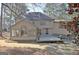 Exterior view with a sunroom, wooden deck, and landscaped backyard at 245 Highview Trce, Fayetteville, GA 30215