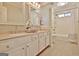 Bathroom featuring a dual sink vanity, decorative mirrors, and a shower/tub combo at 245 Highview Trce, Fayetteville, GA 30215
