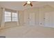 Bedroom with neutral walls and carpet, a ceiling fan, closet, and window with curtains at 245 Highview Trce, Fayetteville, GA 30215