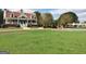 Community clubhouse with a red roof, brick base, and mature trees at 245 Highview Trce, Fayetteville, GA 30215