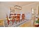 Formal dining room with hardwood floors, stylish light fixture, and view to the kitchen at 245 Highview Trce, Fayetteville, GA 30215