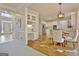 Open dining area featuring hardwood floors, stylish lighting, and entry to the kitchen at 245 Highview Trce, Fayetteville, GA 30215
