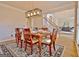 Dining room featuring a wooden table, chairs, a stylish light fixture, and open access to other rooms at 245 Highview Trce, Fayetteville, GA 30215