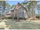 Two-story brick home with mature trees, a well-manicured lawn, and manicured shrubs at 245 Highview Trce, Fayetteville, GA 30215