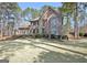 Two-story brick home with mature landscaping, a well-manicured lawn and manicured shrubs at 245 Highview Trce, Fayetteville, GA 30215