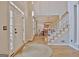 Bright foyer with hardwood floors, staircase, and view to the formal dining area at 245 Highview Trce, Fayetteville, GA 30215