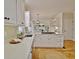 Modern kitchen with quartz countertops, stainless steel appliances, and views to living space at 245 Highview Trce, Fayetteville, GA 30215