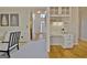 Inviting living space featuring built-in shelving, hardwood floors, and a cozy, built-in desk area at 245 Highview Trce, Fayetteville, GA 30215