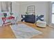 Well-lit living room featuring hardwood floors, neutral decor, and stylish furnishings at 245 Highview Trce, Fayetteville, GA 30215