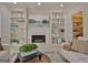 Bright living room featuring custom built-ins surrounding the fireplace, and stylish decor at 245 Highview Trce, Fayetteville, GA 30215