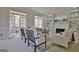Cozy living room with a fireplace, built-in shelves, and French doors leading to outdoor space at 245 Highview Trce, Fayetteville, GA 30215