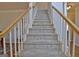 Wide, carpeted staircase with wooden railing at 245 Highview Trce, Fayetteville, GA 30215
