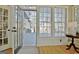 A sunroom with hardwood floors and lots of natural light, with a view of the outdoor deck at 245 Highview Trce, Fayetteville, GA 30215
