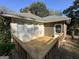 View of a section of the back deck and adjacent screened-in porch at 3 Elm St, Porterdale, GA 30014