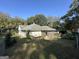 View of the rear of the home, featuring a wooden deck and screened-in porch at 3 Elm St, Porterdale, GA 30014