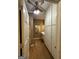 Bathroom featuring white cabinetry and wood look flooring at 3 Elm St, Porterdale, GA 30014