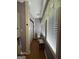 Bathroom showcasing natural light, wood-look flooring, and a toilet in a cozy space at 3 Elm St, Porterdale, GA 30014