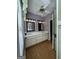 Bright bathroom features a double sink vanity, wood-look flooring, and natural light at 3 Elm St, Porterdale, GA 30014